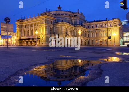 Mariinsky Theatre and Opera House in Saint Petersburg, Russia surprised during the twilight of the June's white nights while reflection in a small rai Stock Photo