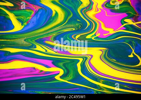 Multicolored acrylic paint flowing fluid trend bright colorful background. Stock Photo