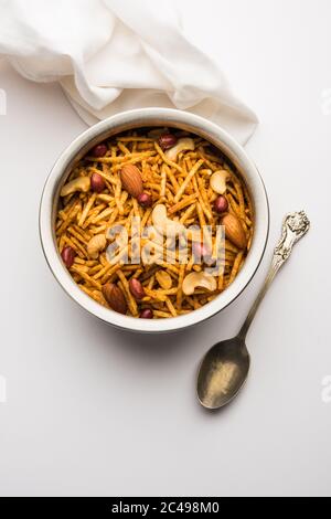 Aloo Chivda or Potato Chiwda also known as Falahari Namkeen for Vrat.  Traditional Fasting snack recipe from India, garnished with Cashew Nuts and Alm Stock Photo