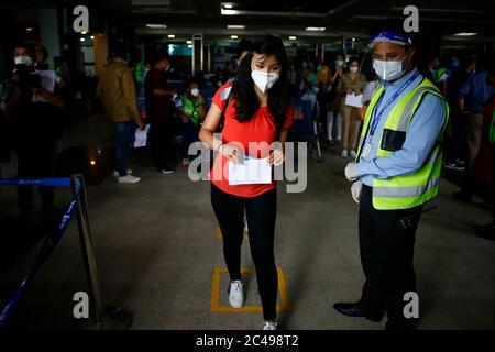 Kathmandu, Nepal. 25th June, 2020. A passenger of Buddha Air walks towards her flight during a mock drill to make necessary preparations for the resumption of domestic and international flights starting August 1 as Nepal has suspended all passenger flights enforcing the lockdown to contain the spread of coronavirus disease at Tribhuvan International Airport in Kathmandu, Nepal on Thursday, June 25, 2020. Credit: Skanda Gautam/ZUMA Wire/Alamy Live News Stock Photo