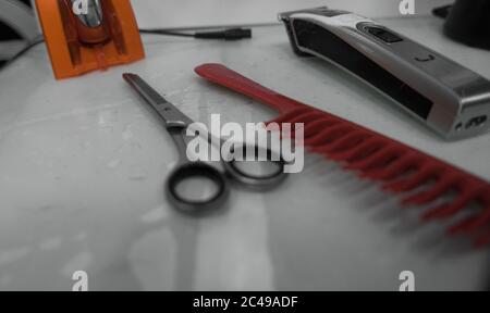Barber shop equipment on desk. Professional hairdressing tools. electric razor,comb and scissors Stock Photo