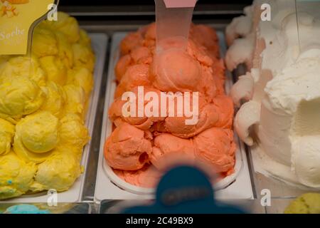 ice creams in shop refrigerator - Ice Cream Showcase Fridge for Mall Shop Stock Photo