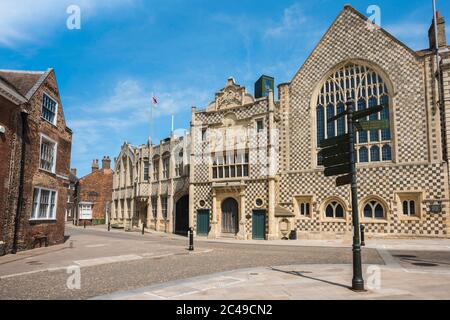 Guildhall Kings Lynn, the 15th century Trinity Guildhall building with its chequered flint and stone facade in Saturday Market Place, King's Lynn, UK Stock Photo