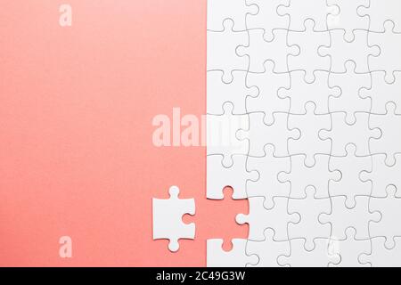 Set of white puzzle pieces and last one piece Stock Photo