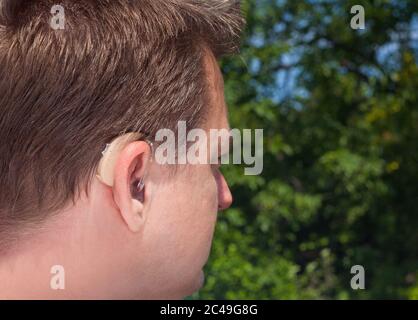 Hearing aid - outdoor wearing Stock Photo