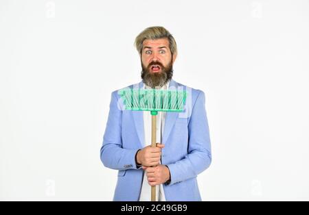 Personnel shifts. New responsibilities. Demotion concept. Crisis and unemployment. I agree to any work. Businessman hold broom. Financial crisis concept. Global crisis and unemployment. Qualified. Stock Photo