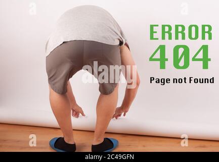 Funny http 404 error landing page background with a photographer setting a white backdrop. Stock Photo