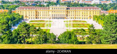 VIENNA, AUSTRIA - 23 JULY, 2019: Schonbrunn Palace, German - Schloss Schonbrunn, and Great Parterre French Garden with beautiful flower beds in Vienna, Austria Stock Photo