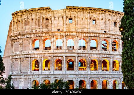 Colosseum, or Coliseum. Illuminated huge Roman amphitheatre early in the morning, Rome, Italy. Stock Photo
