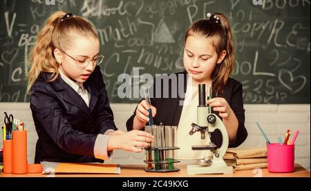 Gymnasium students with in depth study of natural sciences. Private school. Knowledge crossroads molecular biology and chemistry. School project investigation. School experiment. Science concept. Stock Photo