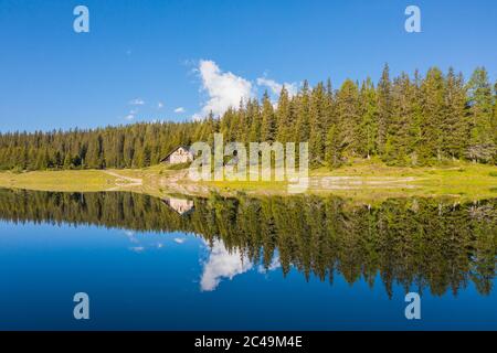 Valmalenco, Palù lake. Little hut and alpine lake in the Italian Alps. Stock Photo