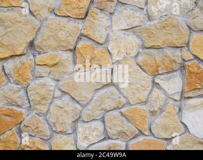 Yellow stone. Natural cobblestone, high detail background, stone background. Stock Photo