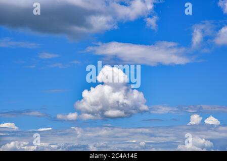 Single cumulus cloud in the blue sky, Bavaria, Germany, Europe Stock Photo