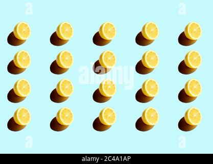 Series of half cut lemons on a blue background Stock Photo