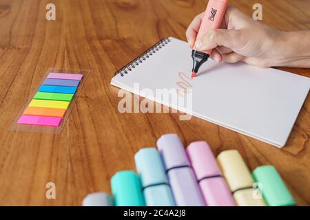 Drawing on a white sheet with a color highlighter Stock Photo