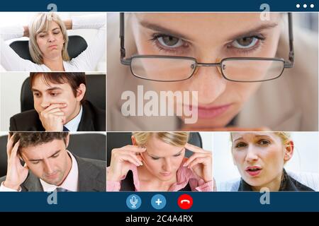 group video call screen of stressed business colleagues having video meeting trying to overcome crisis. Stock Photo