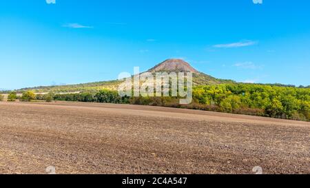 Oblik hill in the middle of Ceske Stredohori, aka Central Bohemian Highlands. Landscape with typical spiky hills of volcanic origin, Czech Republic. Stock Photo