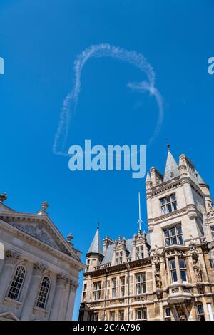 Cambridge, UK. 25th June, 2020. Aerial sign writing or skywriting- an aeroplane draws a heart in a white smoke trail above the historic Cambridge University buildings in the blue sky. Love Cambridge! Credit: Julian Eales/Alamy Live News Stock Photo