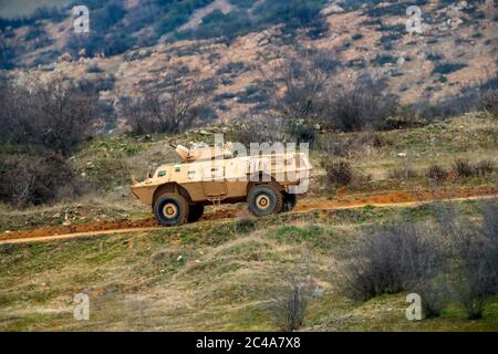 Askos, Greece - Feb 14, 2020: military personnel transport vehicles takes part at a international military exercise with real fire (Golden Fleece -20) Stock Photo