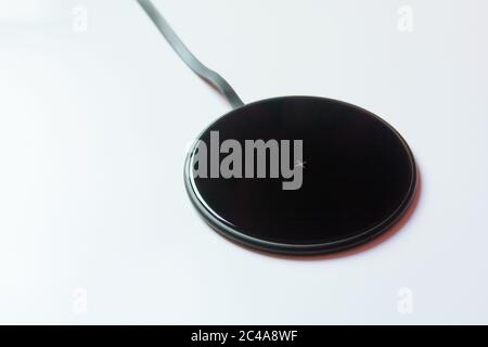 Wireless charger pad on withe background Stock Photo