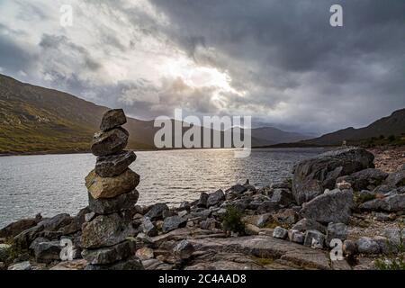 Zen rocks on the shore of Loch Cluanie in Scotland Stock Photo