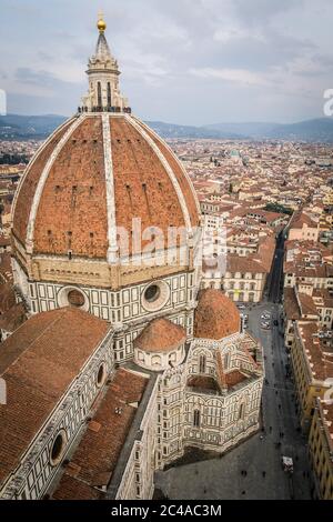 The dome of the Cattedrale di Santa Maria del Fiore (Florence Cathedral) in Piazza del Duomo (square) as seen from the Giotto's Campanile (bell tower) Stock Photo