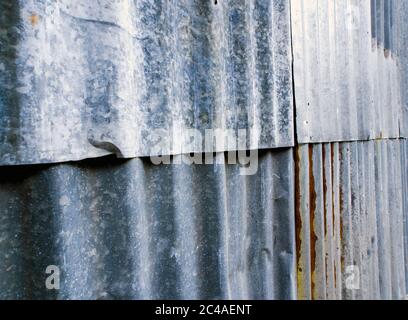 Rusty corrugated galvanized sheet iron fence Stock Photo