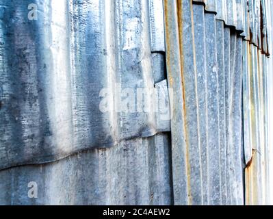 Rusty corrugated galvanized sheet iron fence Stock Photo