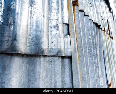 Rusty corrugated galvanized sheet iron fence Stock Photo