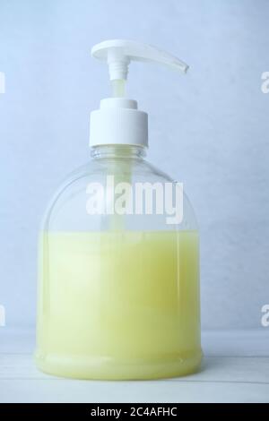 Hand washing soap bottle on table, close up  Stock Photo