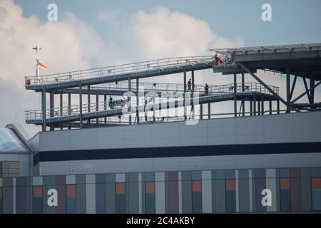 Glasgow, Scotland, UK. 25th June, 2020. Picture: Queen Elizabeth University Hospital (QEUH) helipad which is situated on the south west of the main building. Seen is the Scottish Air Ambulance Service transferring a patient. Credit: Colin Fisher/Alamy Live News Stock Photo