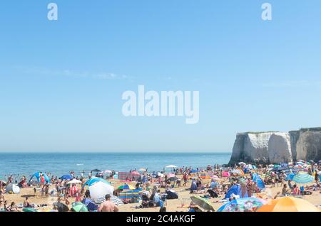Broadstairs, Kent, England  - Despite lockdown restrictions due to the Coronavirus, crowds gather on the sandy beach on the hottest day of the year Stock Photo