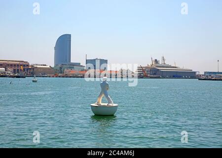 View across the harbourfrom Port Vell towards the commercial harbour, with the floating Stargazer sculpture in the foreground, Barcelona, Spain. Stock Photo