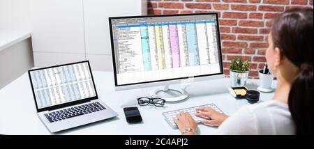 Working With Spreadsheet. Analyzing Data On Laptop Screen Stock Photo
