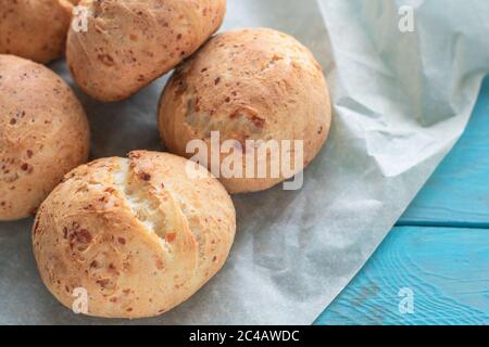 Fresh homemade cakes. Sweet rolls with a golden brown crust on baking paper Stock Photo