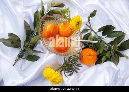 Mandarin orange fruit and confiture in glass cup, top view Stock Photo