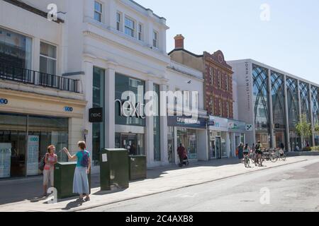 Shops on The High Street in Cheltenham, Gloucestershire in the UK Stock Photo