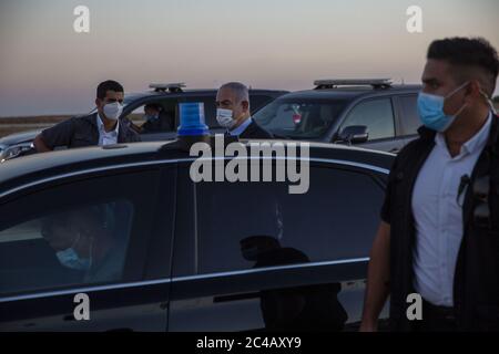Hatzerim, Israel. 25th June, 2020. Israeli Prime Minister Benjamin Netanyahu, wearing a face mask to protect from COVID-19, enters his car after attending a graduation ceremony for new pilots at Hatzerim air force base near the southern Israeli city of Beersheba, Israel, on Thursday, June 25, 2020. Photo by Ariel Schalit/UPI Credit: UPI/Alamy Live News Stock Photo