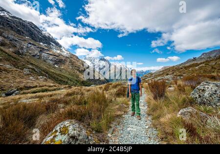 Hikers on the Routeburn Track, Mount Aspiring National Park, Westland District, West Coast, South Island Stock Photo