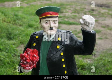Concrete coloured statue of Soviet military commander Ivan Konev painted as Adolf Hitler installed in Koněvova Street in Žižkov district in Prague, Czech Republic, pictured on 24 June 2020. Twelve statues of the controversial Soviet marshal designed by Czech artists Tomáš Vrána, Martina Minařík Pavelková and Václav Minařík were installed temporary in occasion of the Landscape Festival in different places in Koněvova Street named after Ivan Konev who was a commander of the 1st Ukrainian Front of the Red Army which attended the liberation of Prague during the last days of World War II. Stock Photo