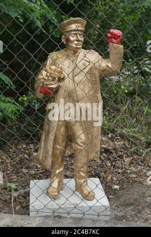 Concrete statue of Soviet military commander Ivan Konev painted gold with red fists installed in Koněvova Street in Žižkov district in Prague, Czech Republic, pictured on 24 June 2020. Twelve statues of the controversial Soviet marshal designed by Czech artists Tomáš Vrána, Martina Minařík Pavelková and Václav Minařík were installed temporary in occasion of the Landscape Festival in different places in Koněvova Street named after Ivan Konev who was a commander of the 1st Ukrainian Front of the Red Army which attended the liberation of Prague during the last days of World War II. Stock Photo
