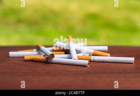 Isolated pile of cigaretts lying on a table Stock Photo