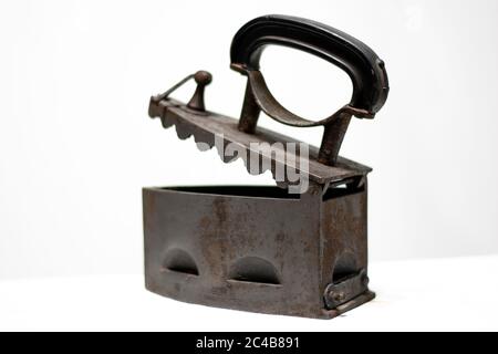 Antique Vintage Old coal iron isolated on white background. Stock Photo