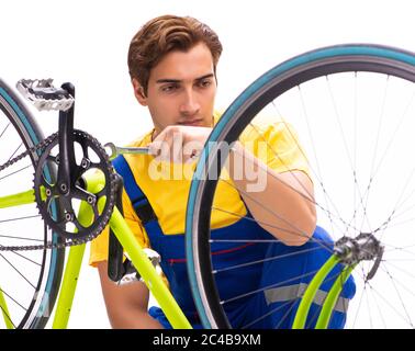 The man repairing his bike isolated on white background Stock Photo