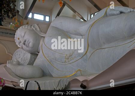 Wat Pa Phu Kon Thailand Blue temple Great Wihan Interior view of white marbled reclining buddha Landscape format Stock Photo