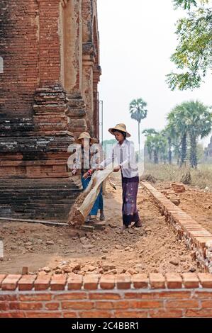 Brick workers restoring a temple in Bagan Myanmar Burma Stock Photo