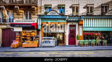 Paris, France, Feb 2020, urban scene in Abbesses street by “La Mascotte” et “L'ecaille” a brasserie and a restaurant in the heart of Montmartre Stock Photo