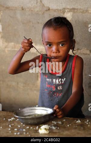 Free food distribution for street children Stock Photo