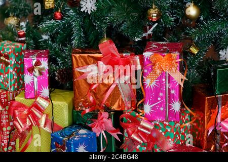 Presents under the decorated artificial christmas tree Stock Photo
