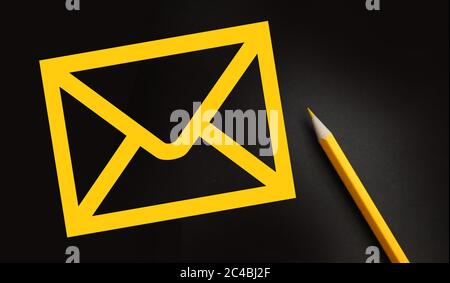 Letter Email Post Icon and yellow pencil besides. Contact us concept Stock Photo